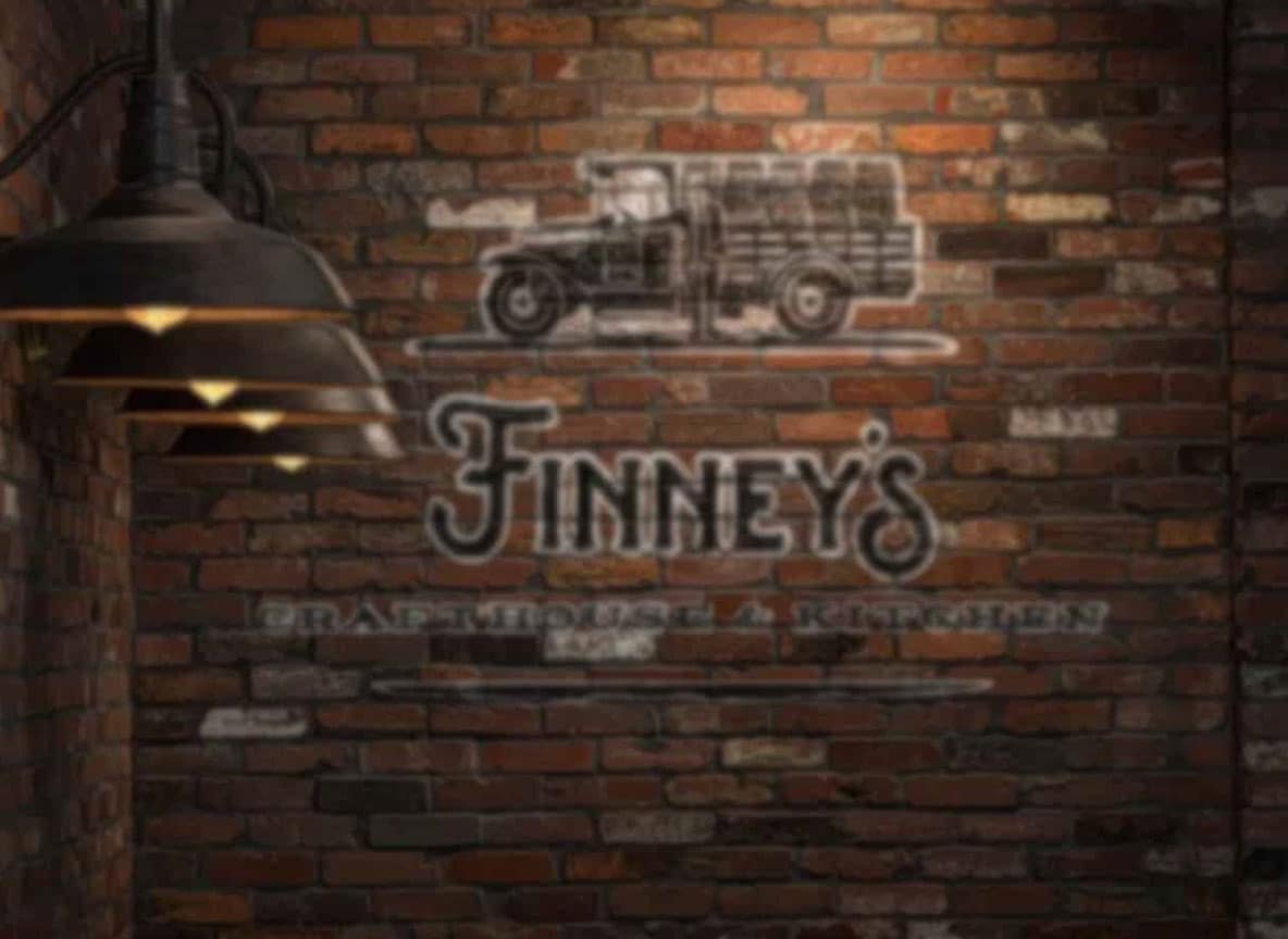 Coming Soon text over a brick wall with the word 'Finney's'.